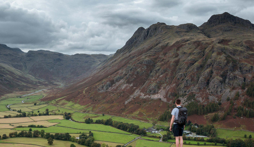 A view of the valley from a guy wearing the Lowe Alpine Aeon 27 rucksack.
