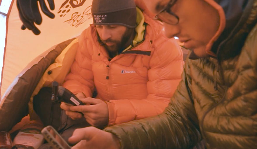 mountaineers inside a tent