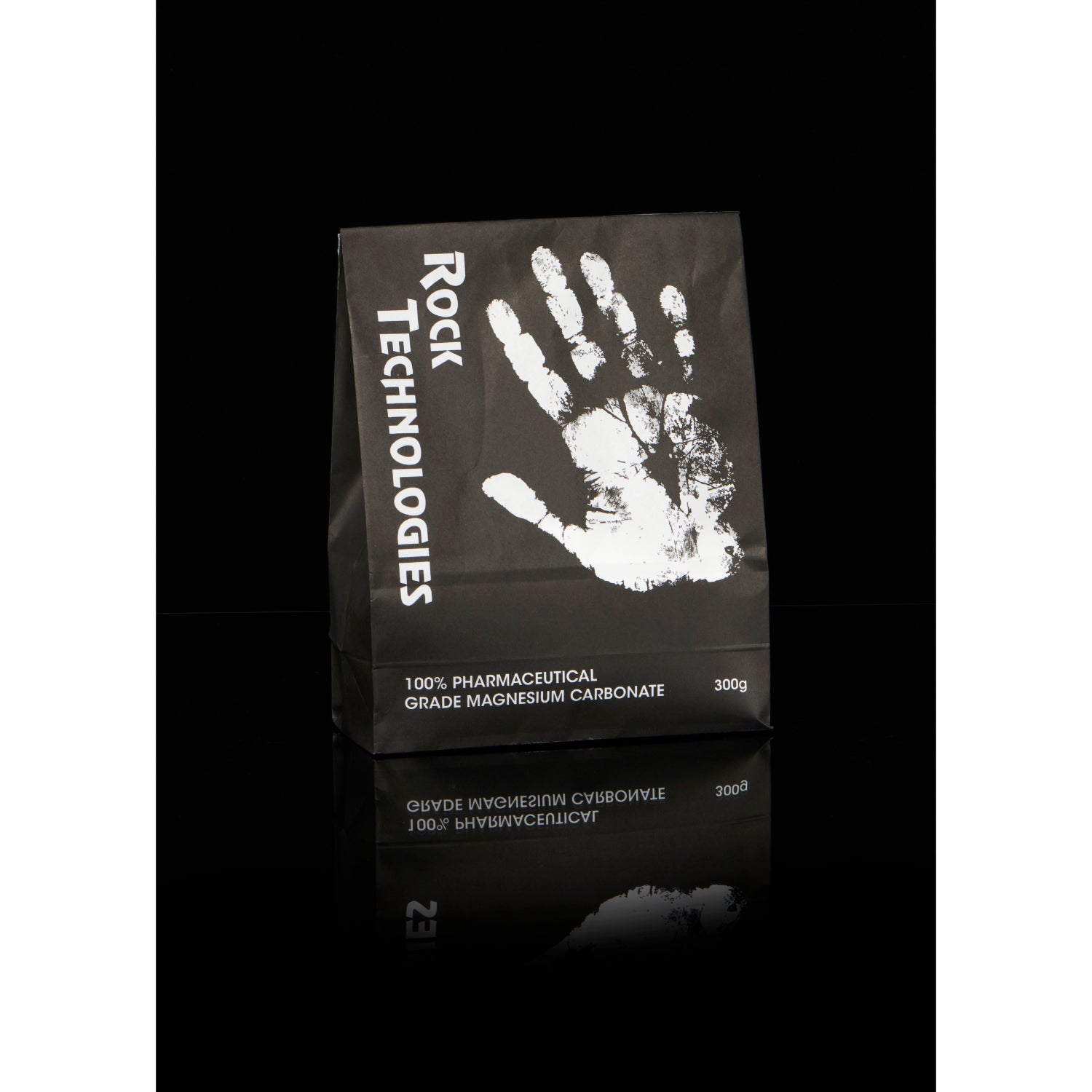 Rock Technologies Loose Chalk 300g in a black and white paper bag 
