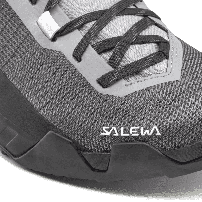 Close-up of a gray hiking shoe with black laces and Salewa branding.