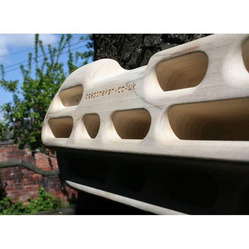 Beastmaker 1000 fingerboard shown fixed outdoors with trees in background