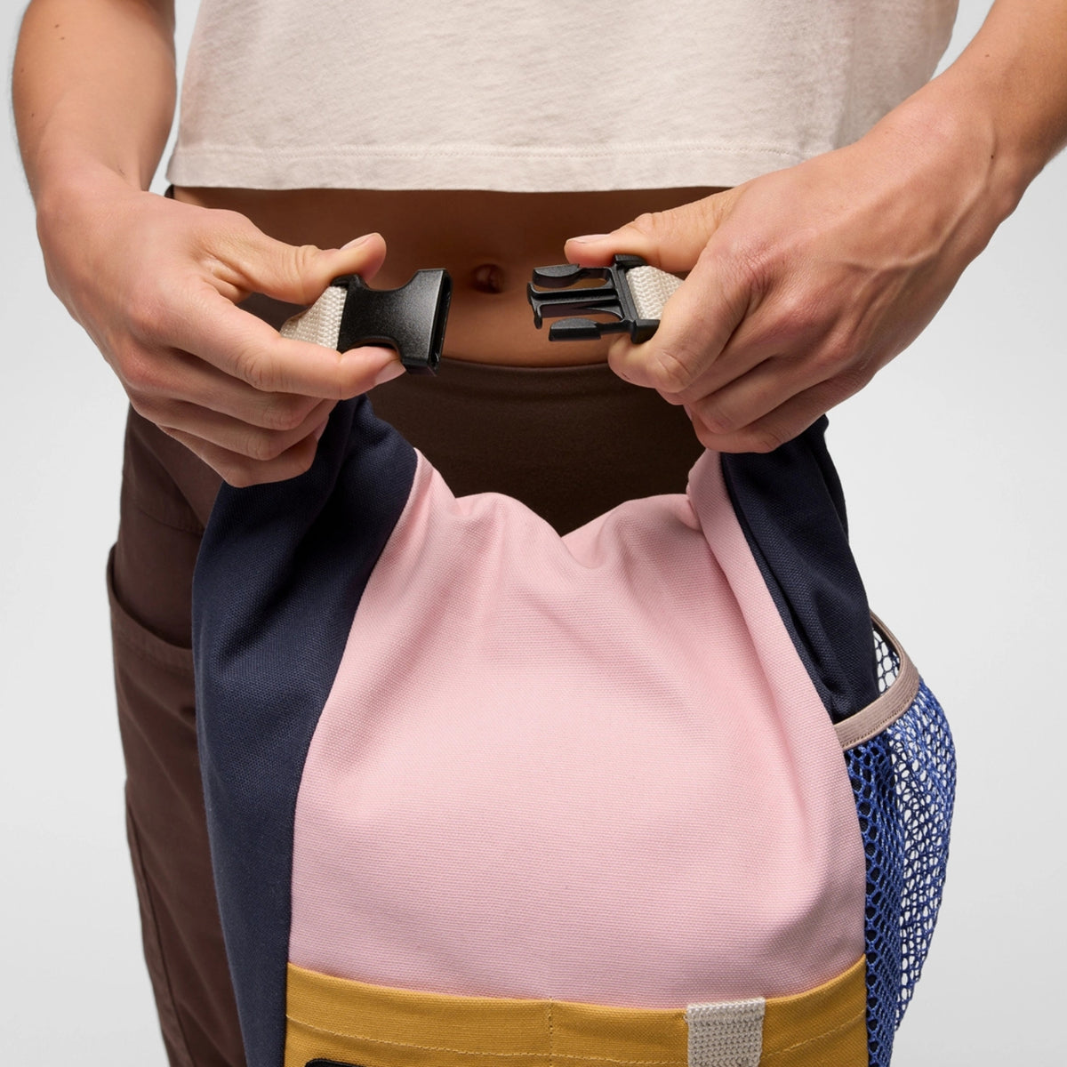 Person holding a drawstring bag with a white background