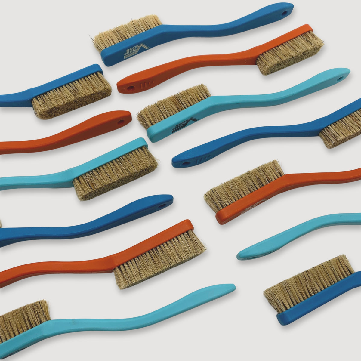 Rock + Run Boars Hair Brushes in colours orange, light blue and dark blue