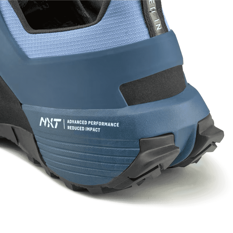 Close-up of a blue and gray shoe with 'MX7' branding on a clear background