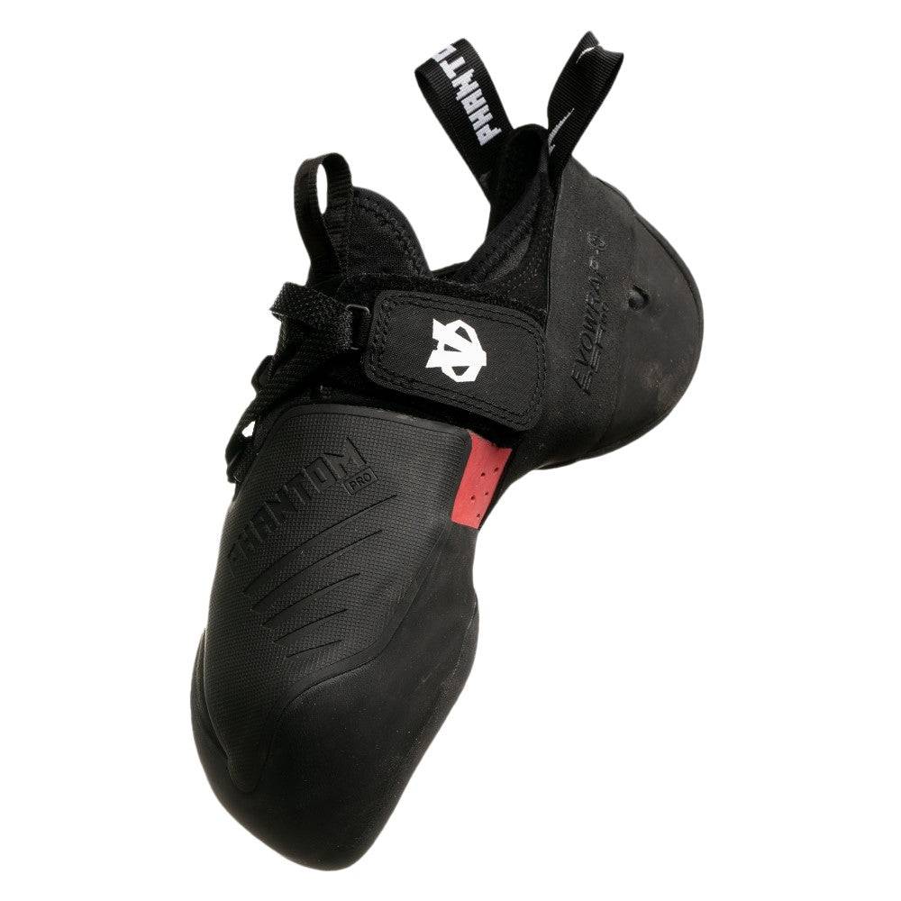 Black climbing shoes with 'Evolv' branding on a white background