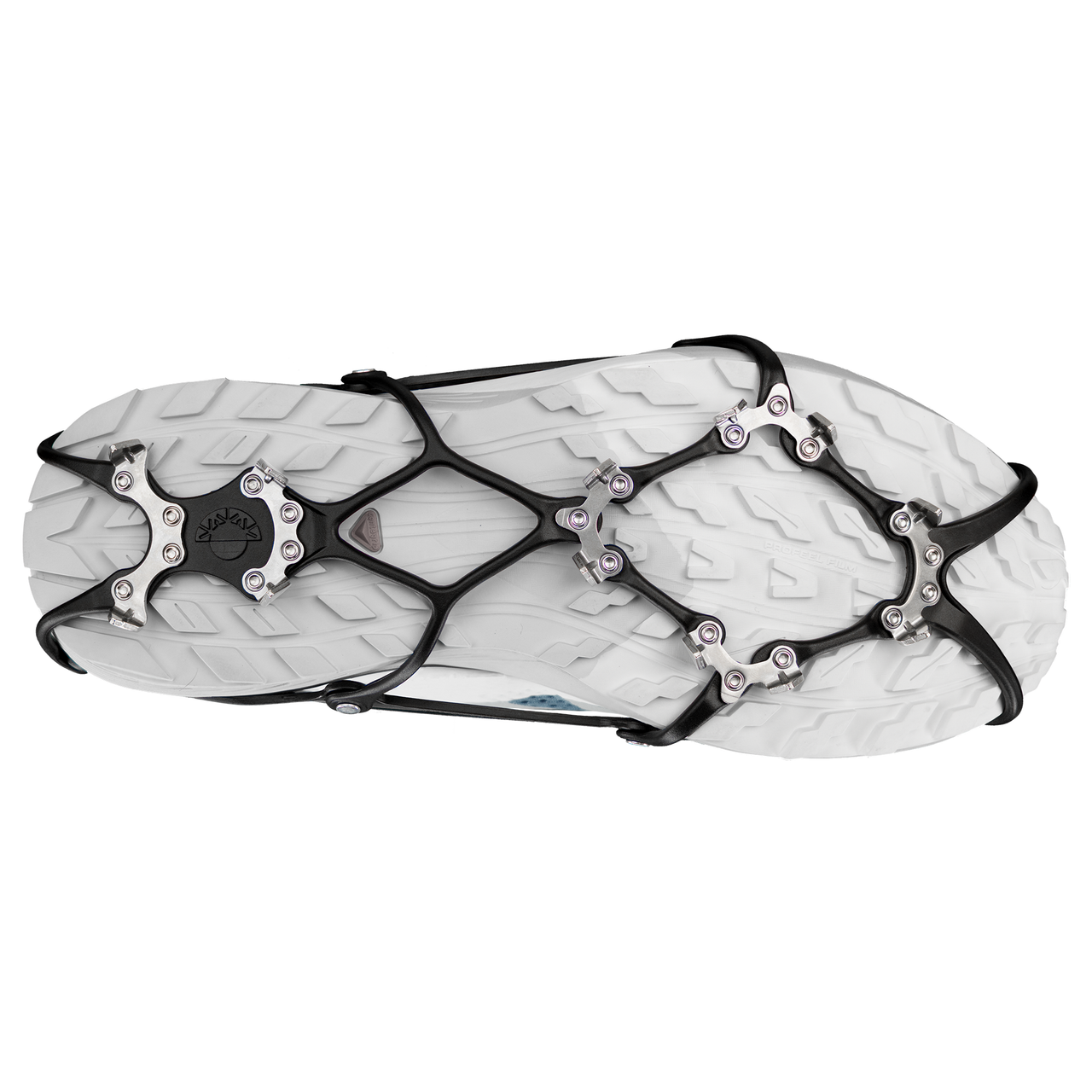 Kahtoola micro ghost spikes in red and black on a running shoe with a white background