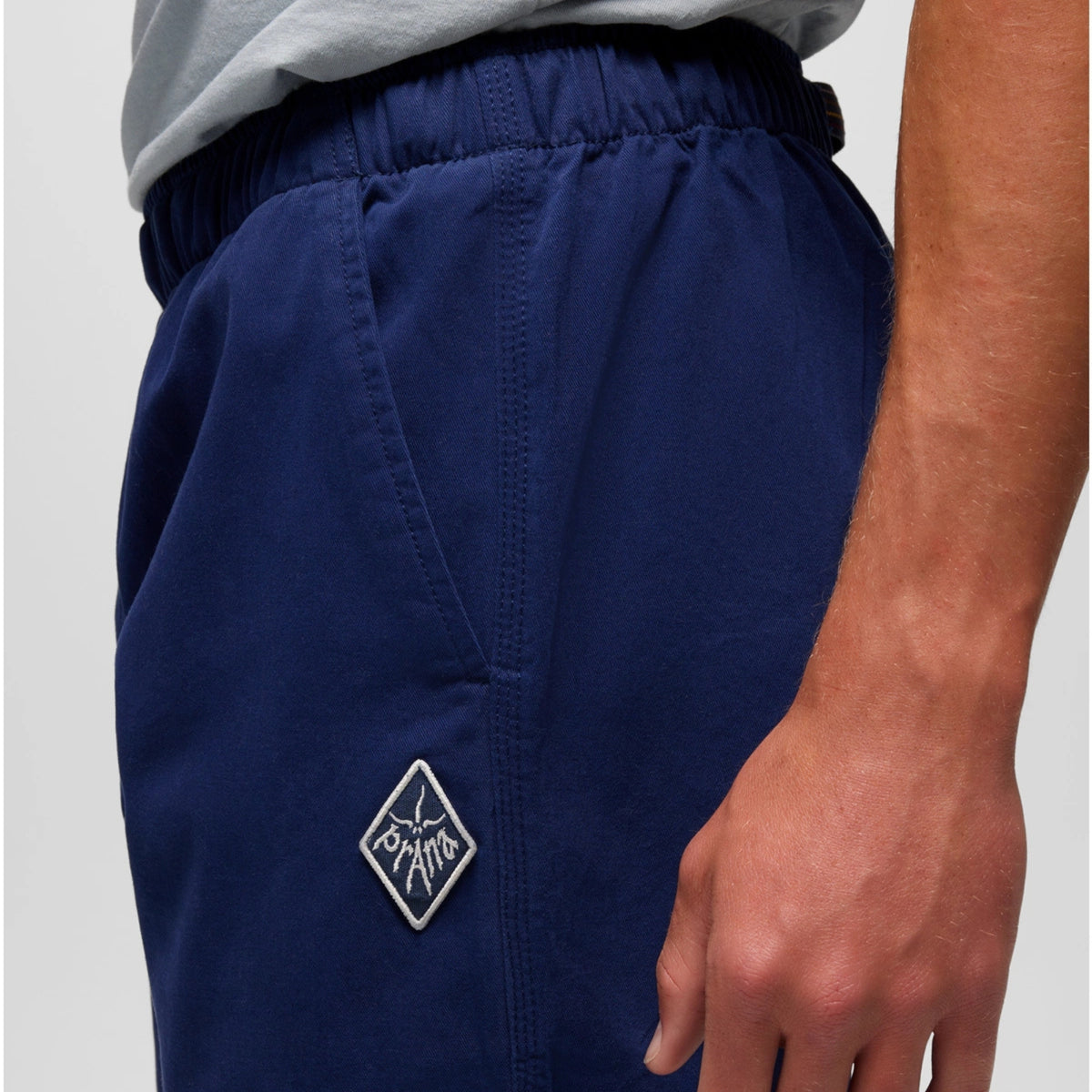 Navy shorts with a logo on a gray background