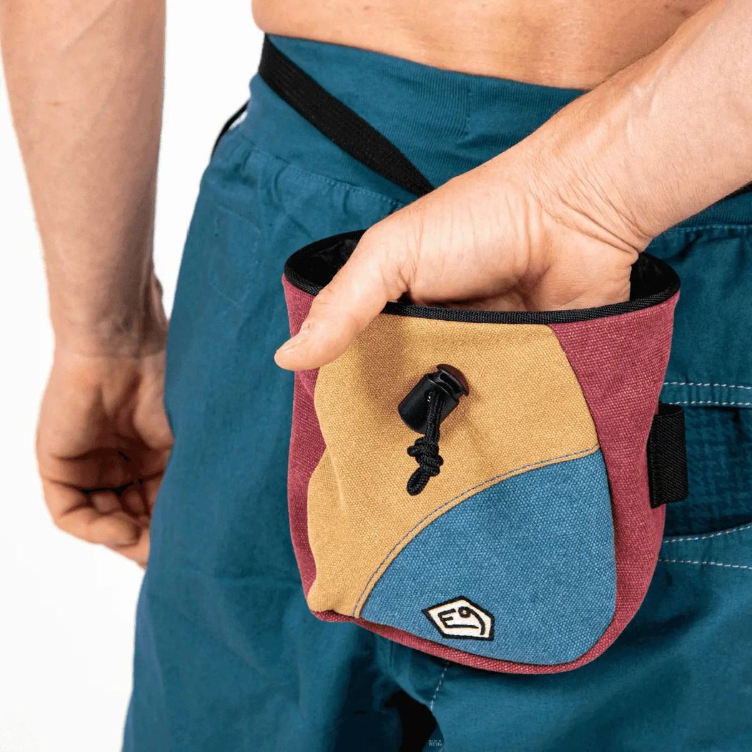 Multicolored pouch with a logo on a white background