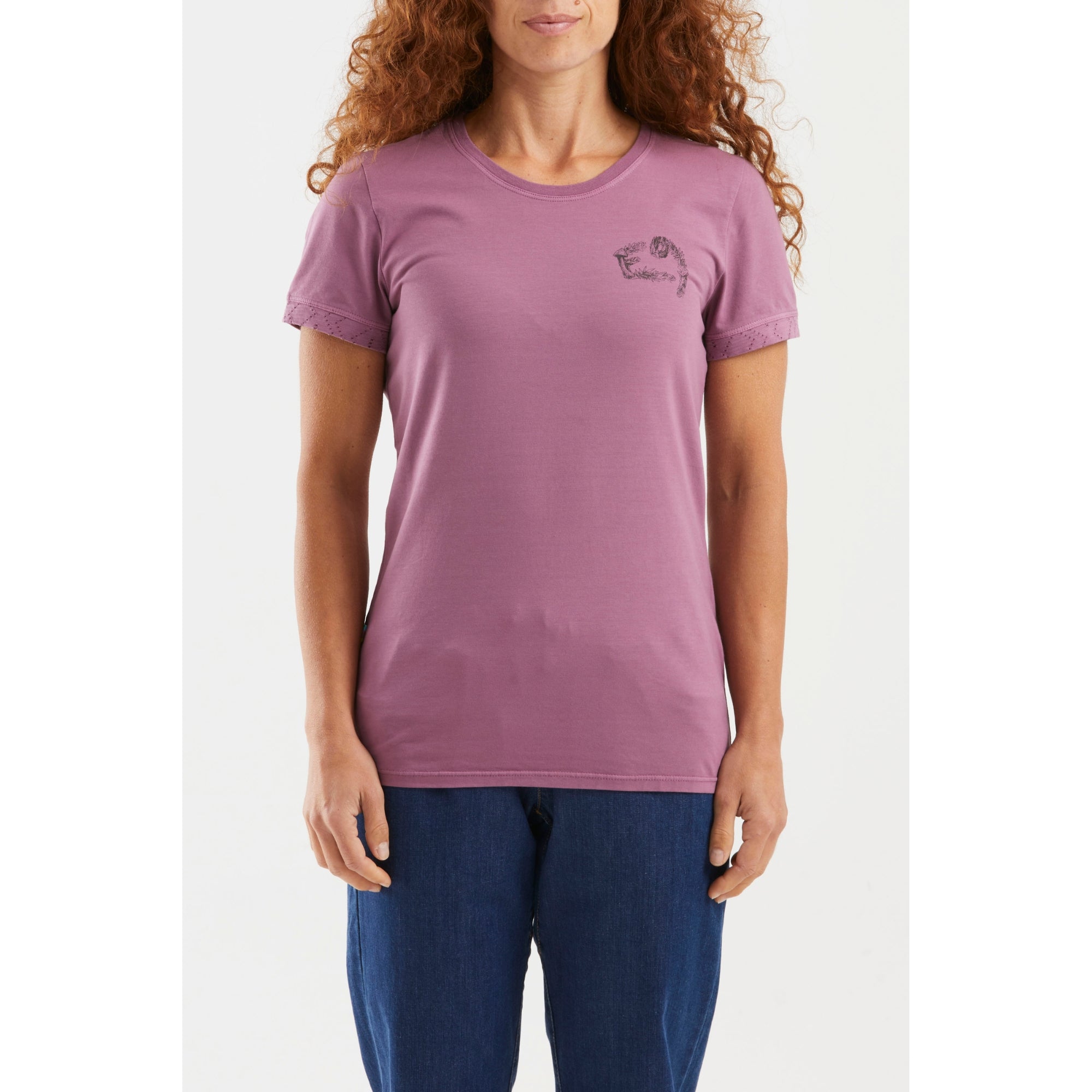 Purple t-shirt with green leafy design on the back, worn by a person.