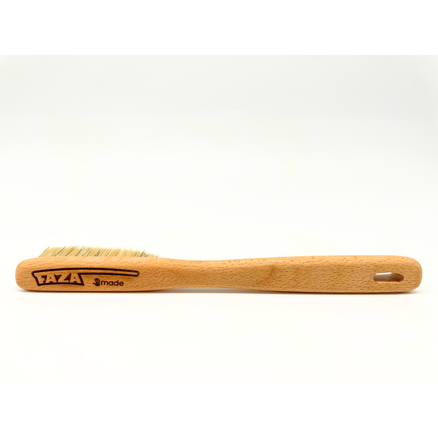 A small wooden-handled brush with natural bristles, shown in profile against a plain white background.
