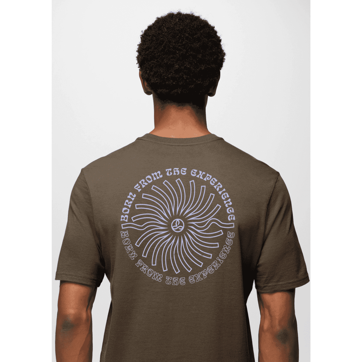 Model wearing Prana Lands Beginning T-Shirt showing back design with bold graphic and sustainable cotton fabric.
