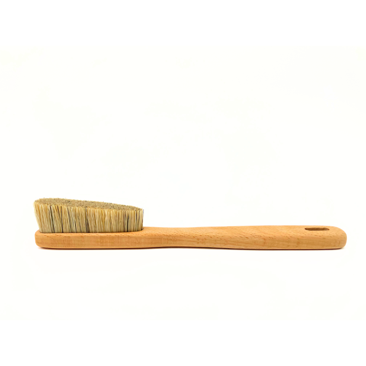 A small wooden-handled brush with natural bristles, shown in profile against a plain white background.