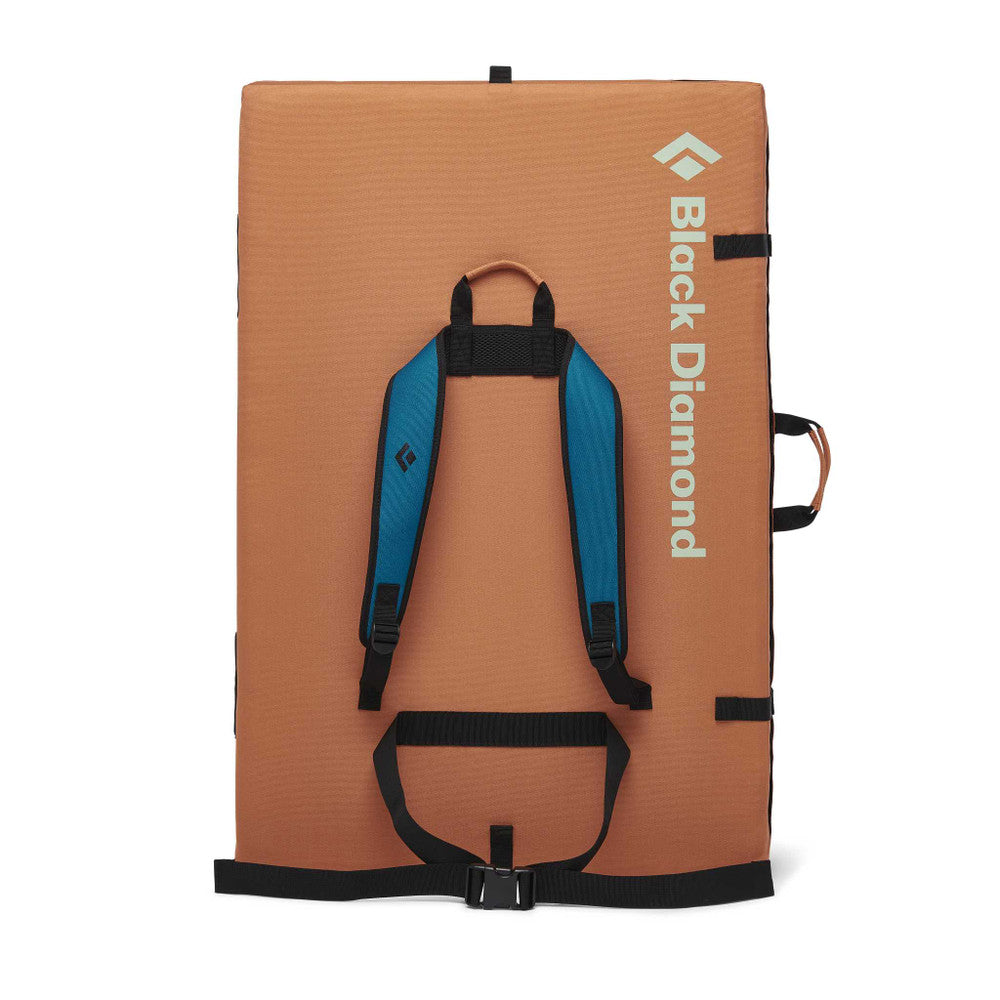 Black Diamond Circuit Crash Pad in lagoon colour. folded up showing shoulder straps