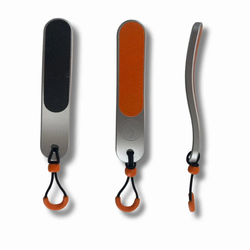 Three skin files brushes with different coloured sandpaper on a white background