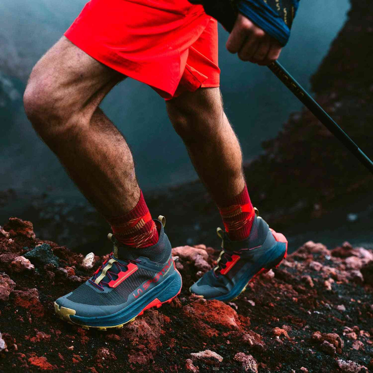 La Sportiva Prodigio Hike GTX - Men's Fast Boots in action on rocky terrain, showcasing GORE-TEX build and rugged grip for high-speed hiking.