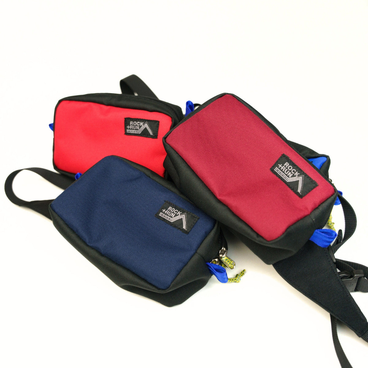 Rock+Run Drone Pack travel waist pack in red, navy, and burgundy color options, ideal for carrying passport, wallet, phone, and travel essentials.