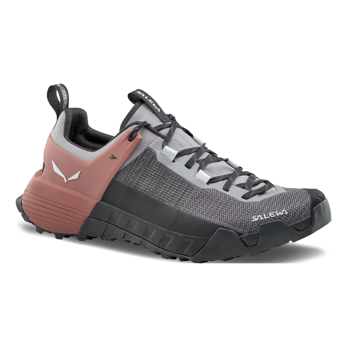 A women's Salewa Wildfire NXT approach shoe with a gray and pink color scheme, featuring a lacing system, rock guard, and a Vibram outsole.