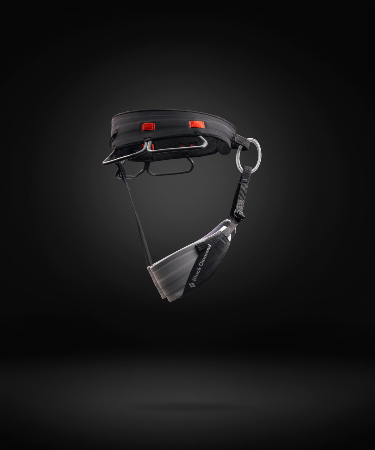 Black and gray climbing harness on a white background