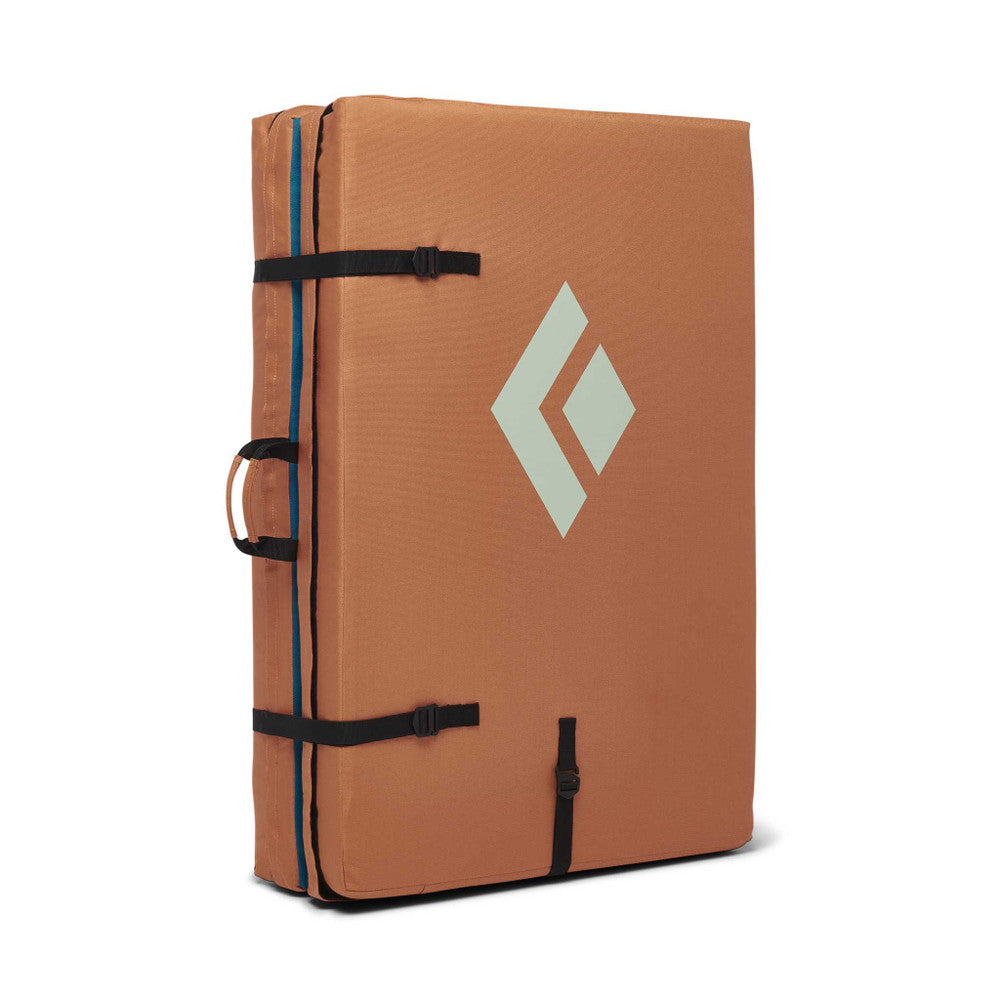 Black Diamond Circuit Crash Pad in rust orange colour. folded up.