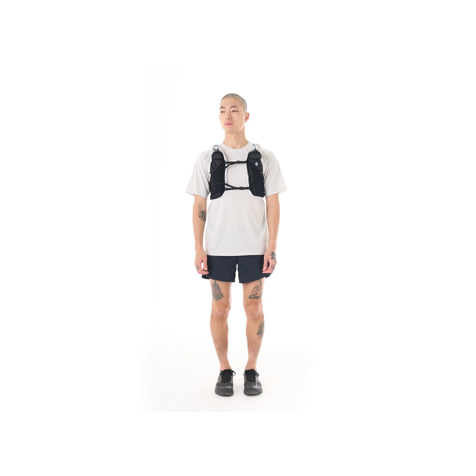 Black and white hydration vest on a white background