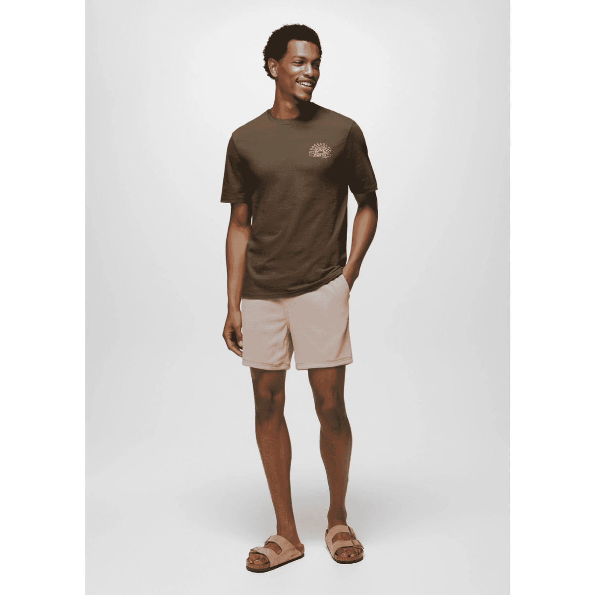 Full body view of model in Prana Lands Beginning T-Shirt and shorts, showcasing casual fit and adventure-ready style.