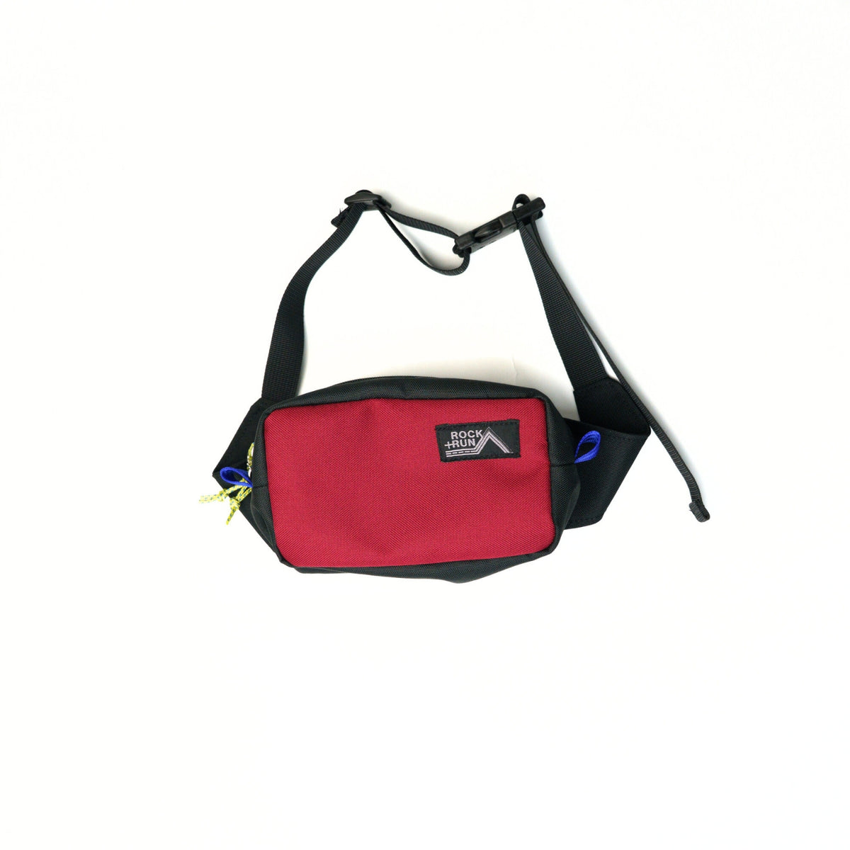 Rock+Run Drone Pack travel waist pack in red and black with adjustable strap, ideal for carrying passport, wallet, phone, and travel essentials.