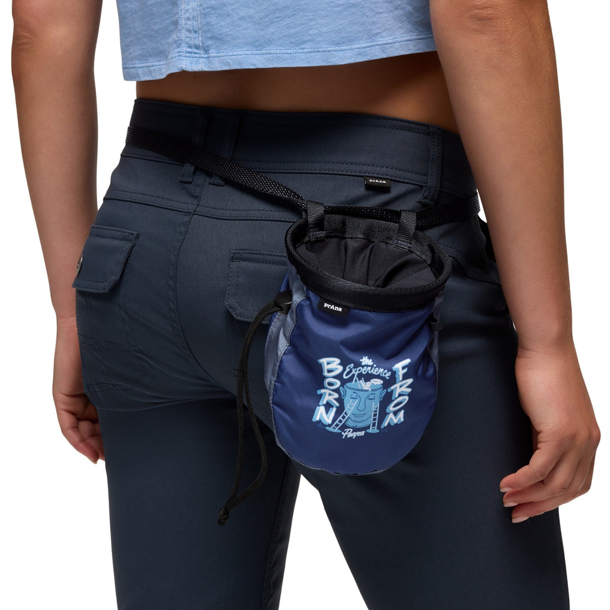 Person wearing navy pants with a blue fanny pack featuring text and graphics.