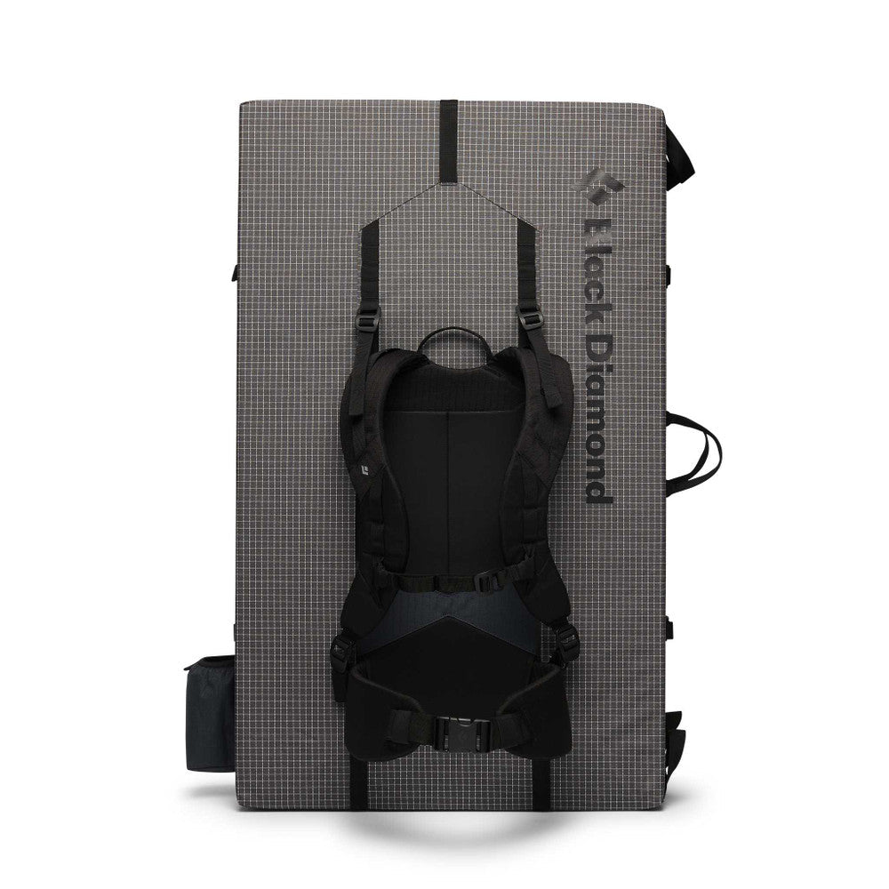 Black Diamond Erratic Crash Pad in green and grey showing carry system