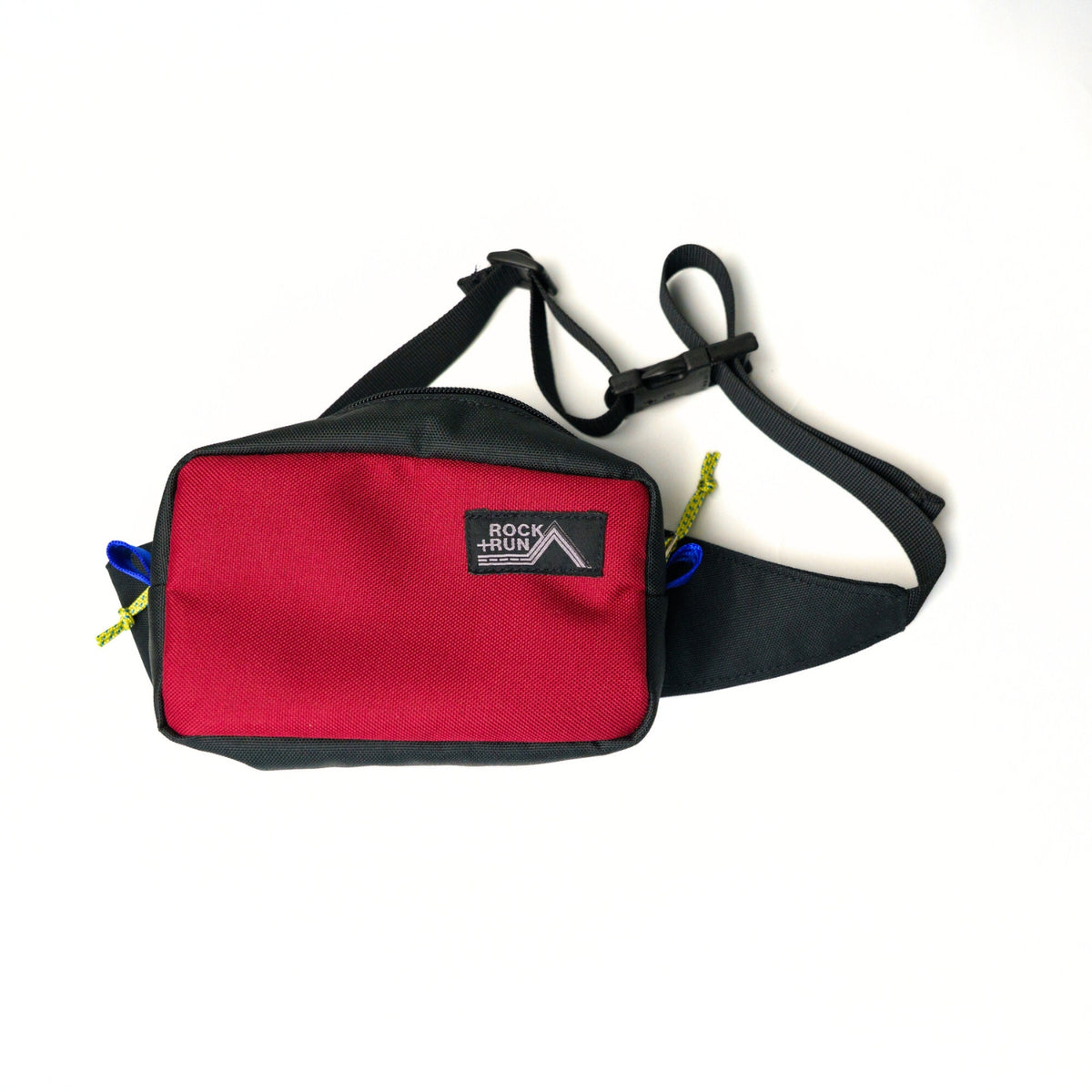 Rock+Run Drone Pack travel waist pack in red and black with adjustable strap, ideal for carrying passport, wallet, keys, and phone on the go.