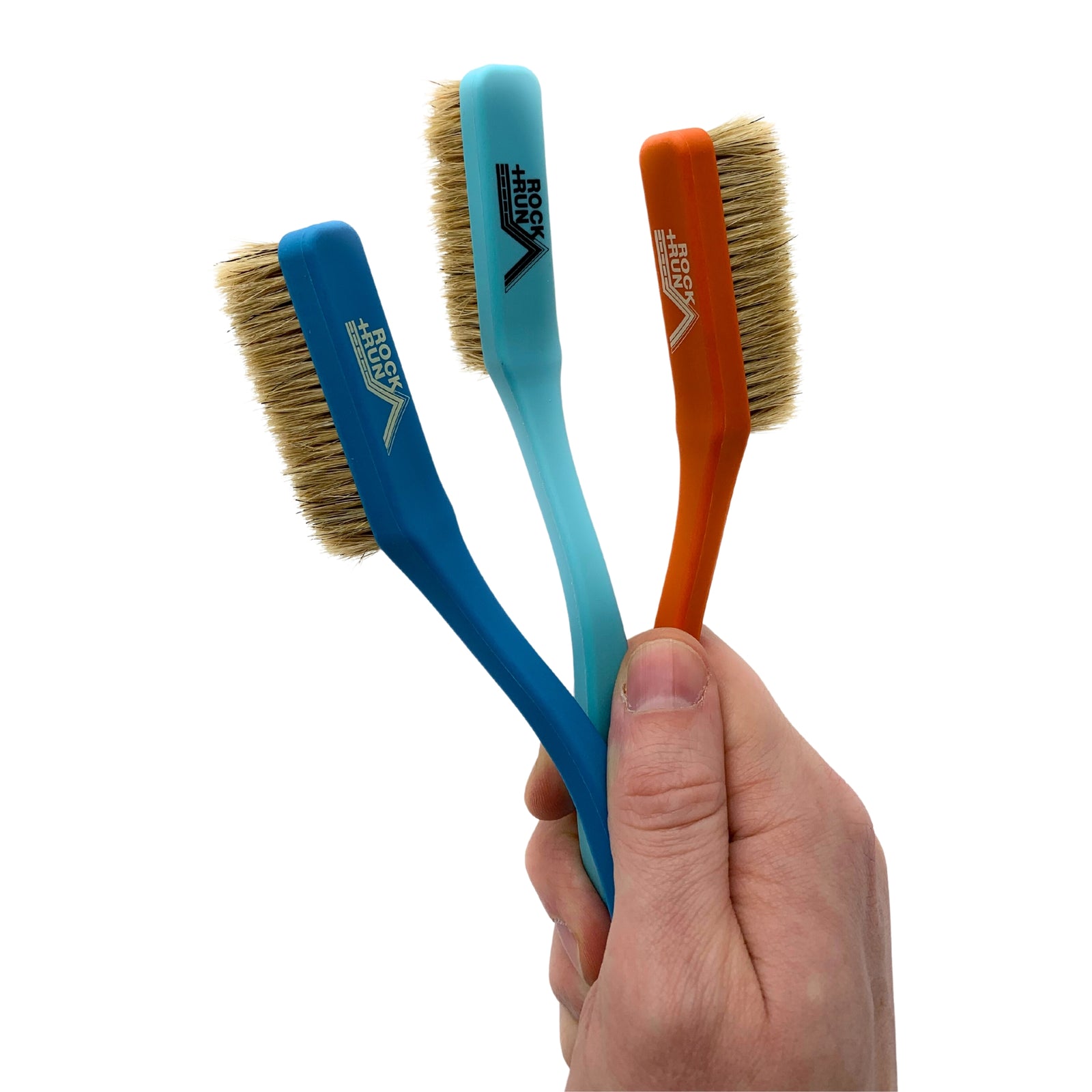 Rock + Run Boars Hair Brush in three colours, dark blue, light blue, orange