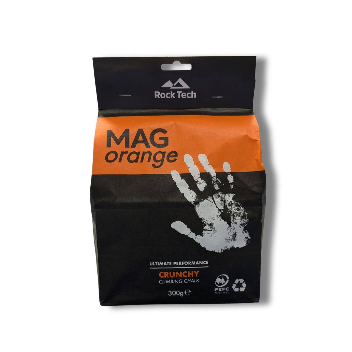 A package of Rock Technologies MAG Orange Chalk 300g. The package is predominantly black and orange with a hand print graphic and product information.