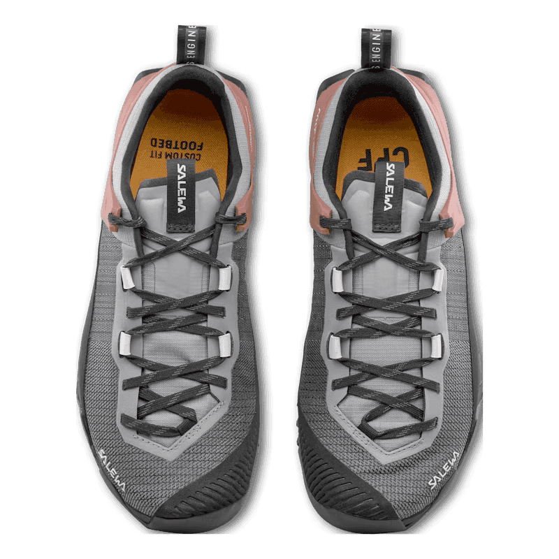 Pair of gray and black sneakers with visible brand logo on a clear background