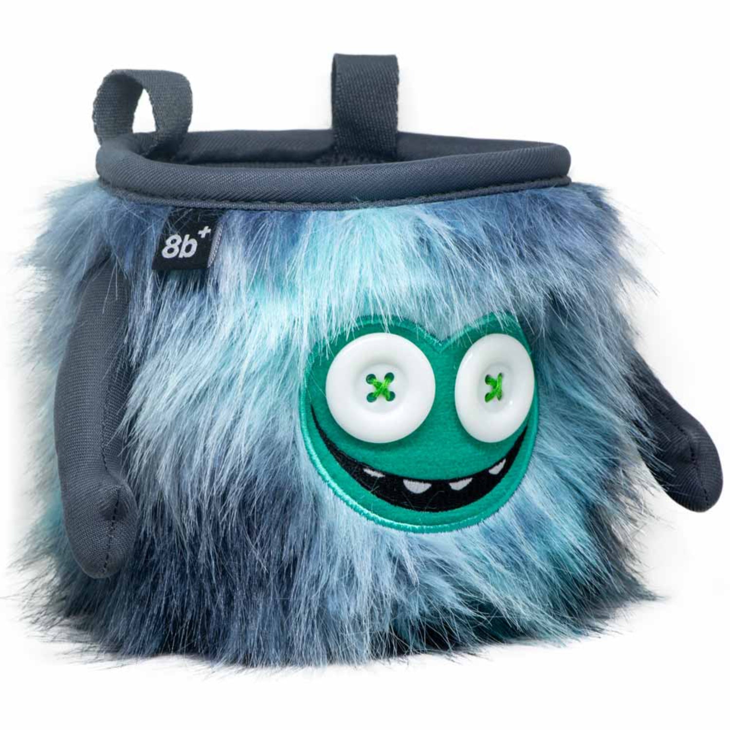 Plush backpack with a blue furry texture, green face, and button eyes on a white background