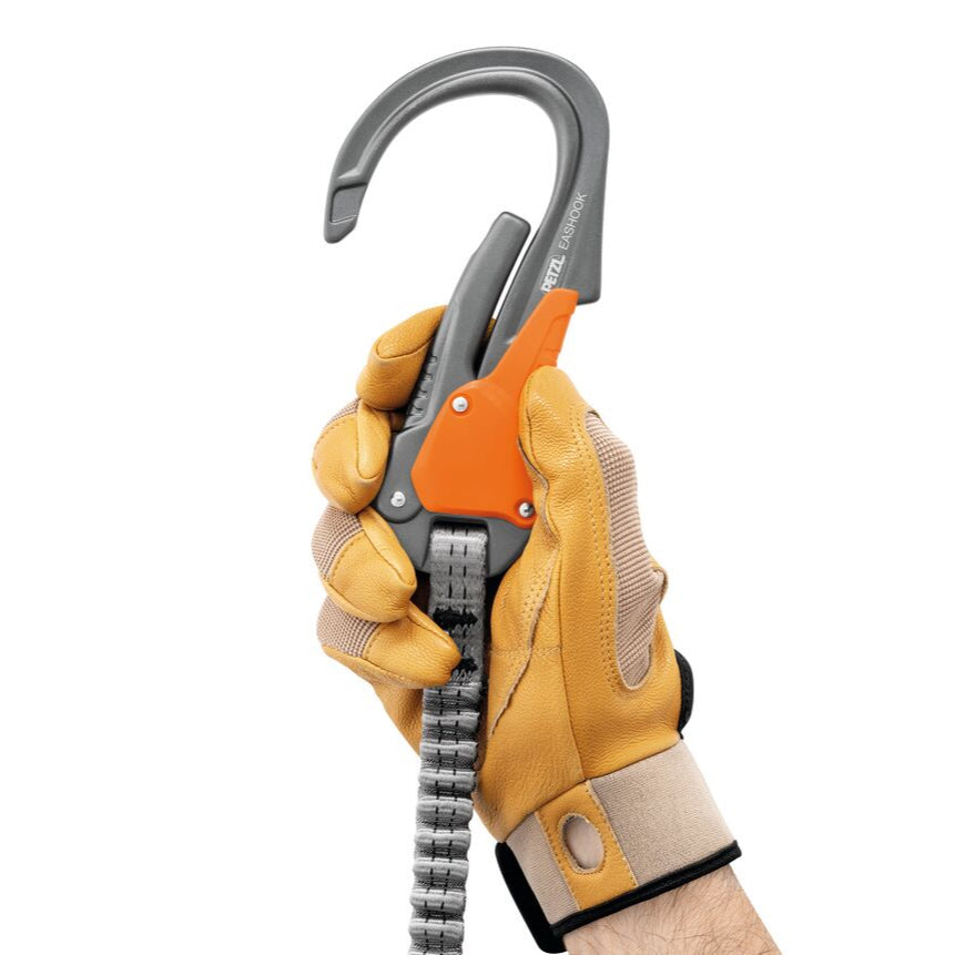 Climbing helmet, harness, and carabiner set on a white background