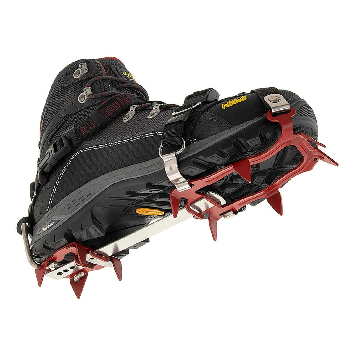 Black hiking boot with red crampon on a white background
