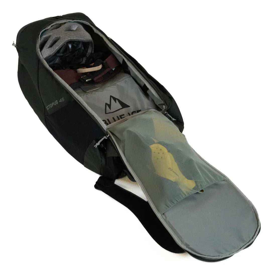 Interior view of Blue Ice Octopus 45L rucksack with helmet, shoes, and gear compartments, showcasing its organized storage layout.