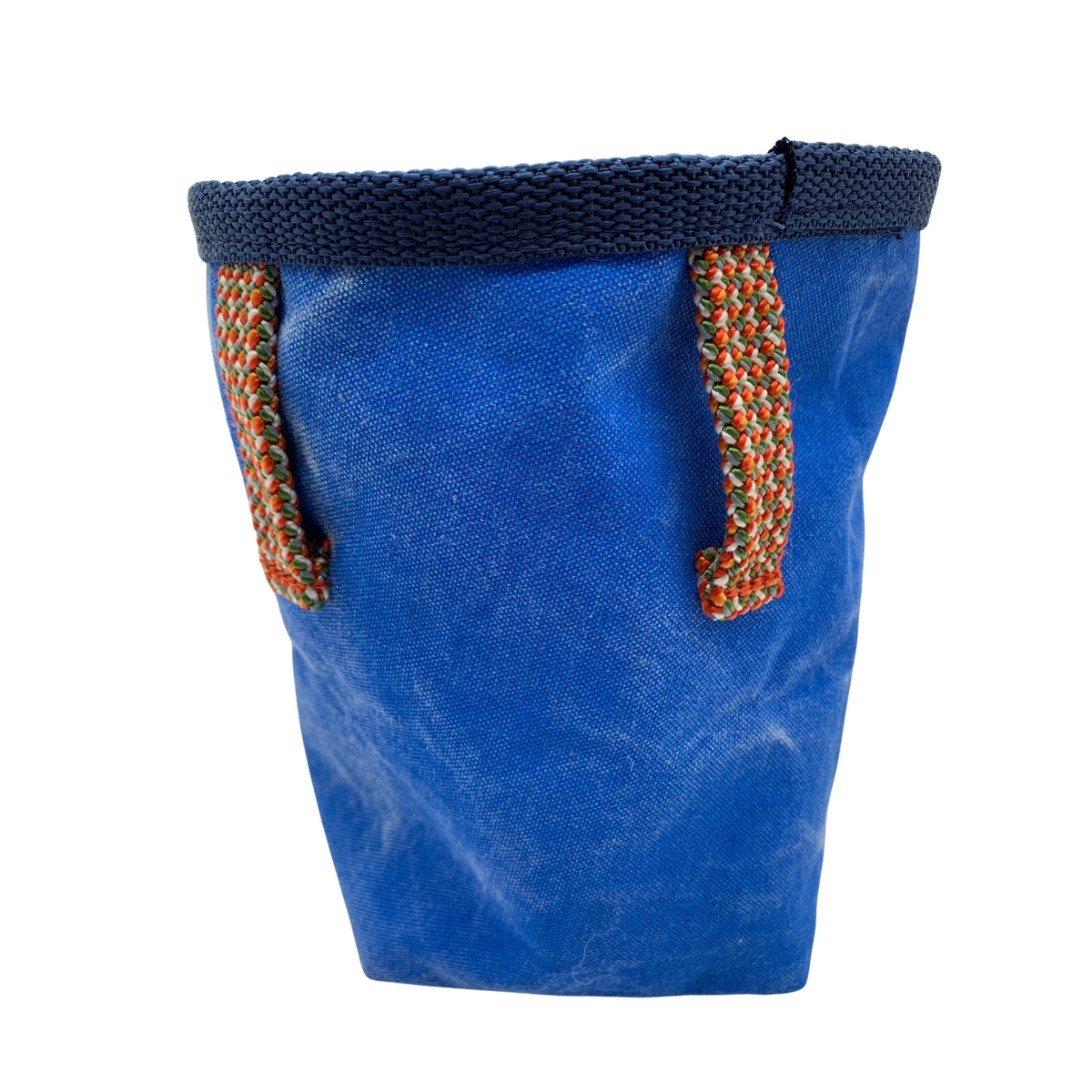 Blue fabric bag with knitted handles on a white background