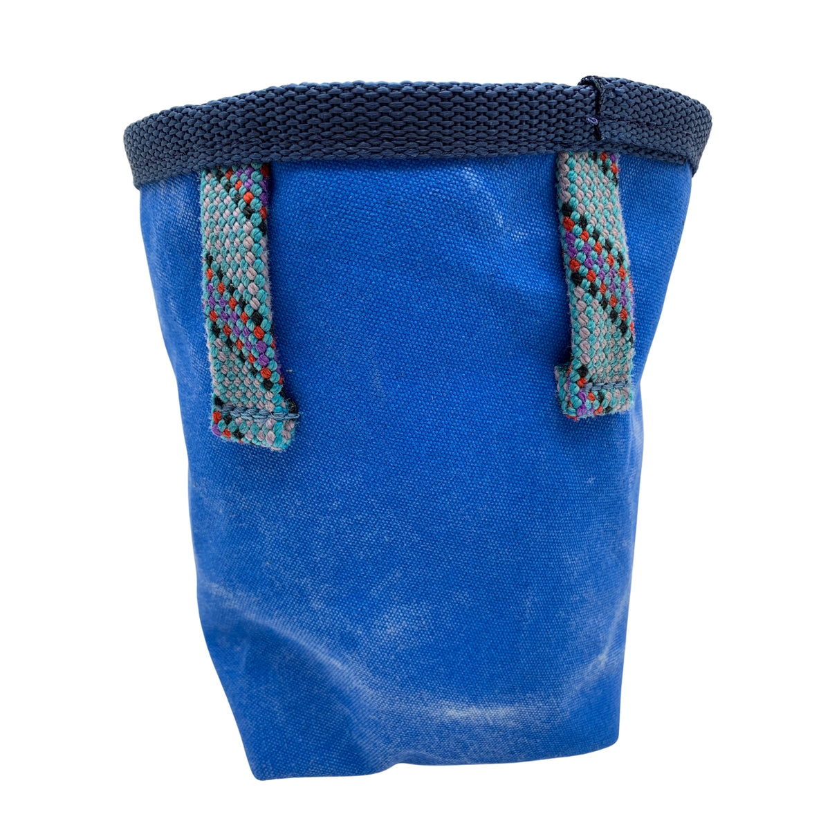 Blue fabric bag with colorful straps on a white background