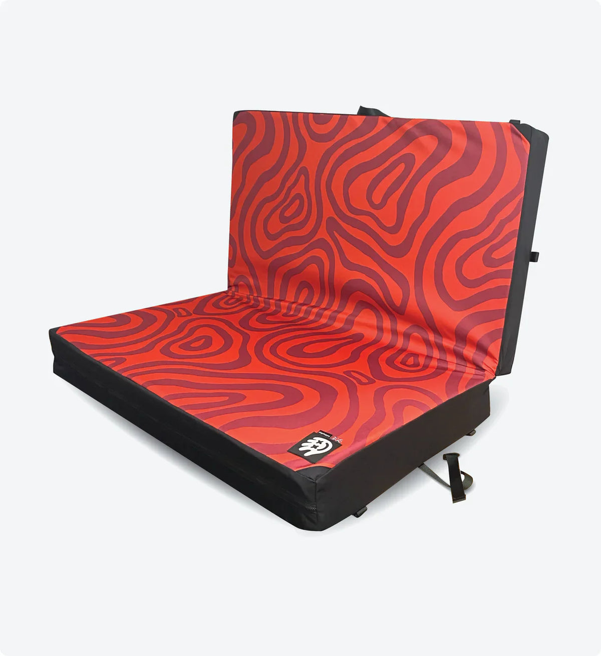 Red and black patterned seat pad on a white background