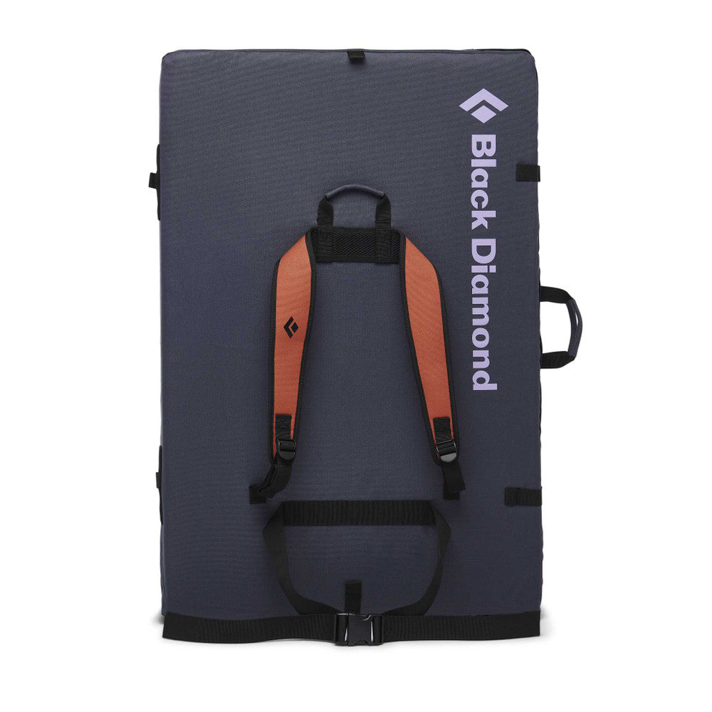 Black Diamond Circuit Crash Pad in rust orange colour. folded up showing shoulder straps