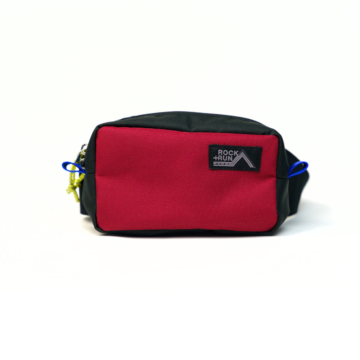 Rock+Run Drone Pack travel waist pack in red and black, ideal for carrying passport, wallet, keys, and phone during travel or outdoor activities.
