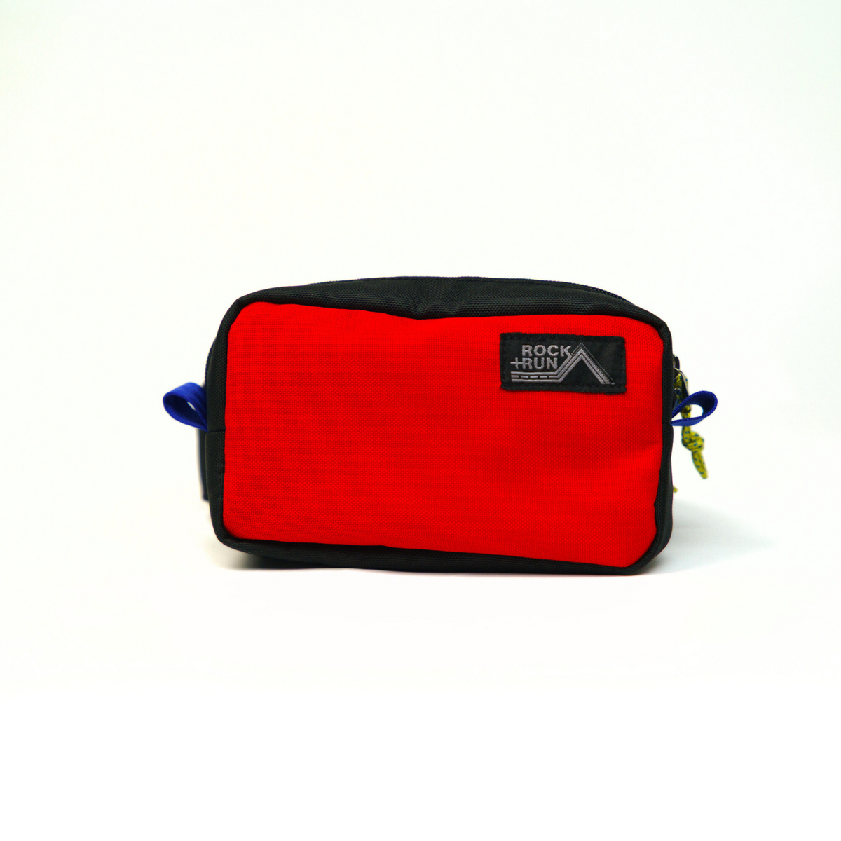 Rock+Run Drone Pack travel waist pack in red and black with front zip pocket, ideal for carrying passport, wallet, keys, and phone.