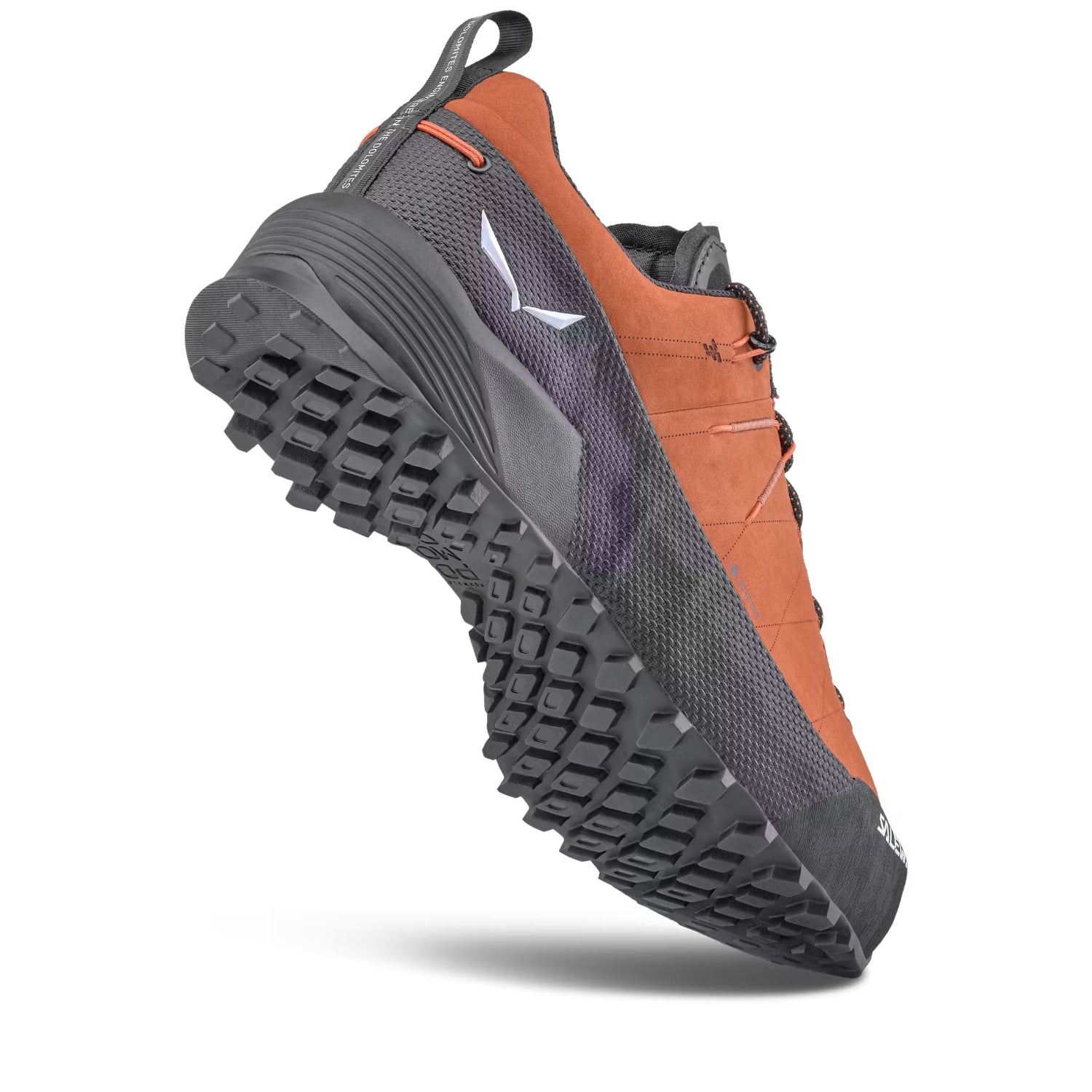 A single Salewa hiking shoe shown at a three-quarter angle on a clean white background. The shoe features a terracotta orange suede upper, dark gray mesh panels, a dark gray synthetic toe cap, and dark gray laces.