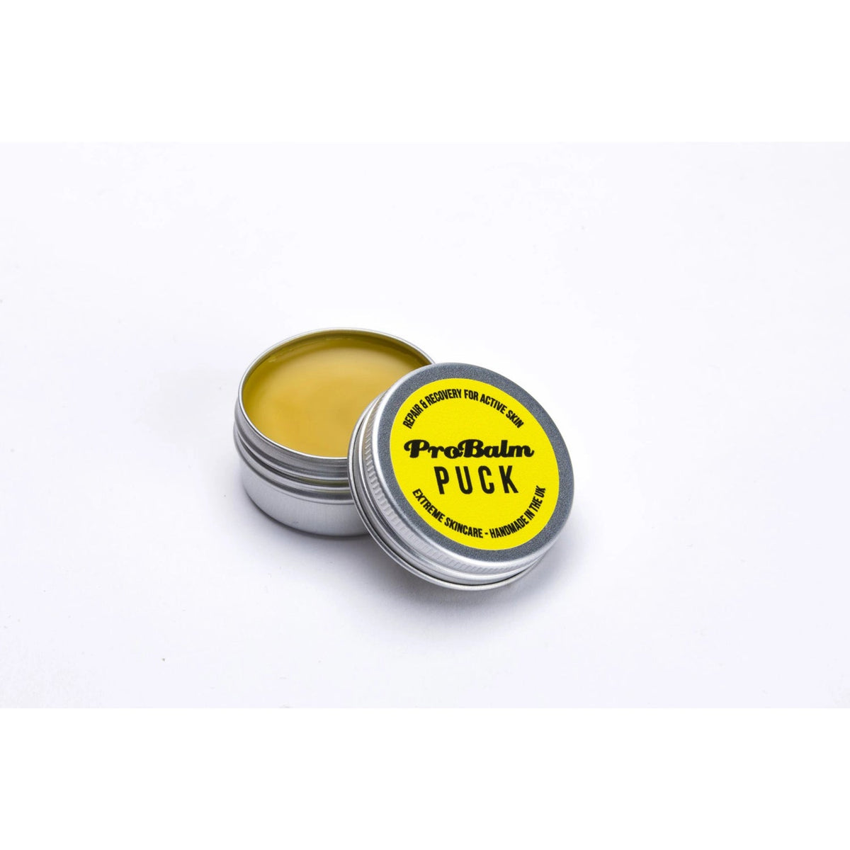 ProBalm Puck 14g, shown in tub with lid half off