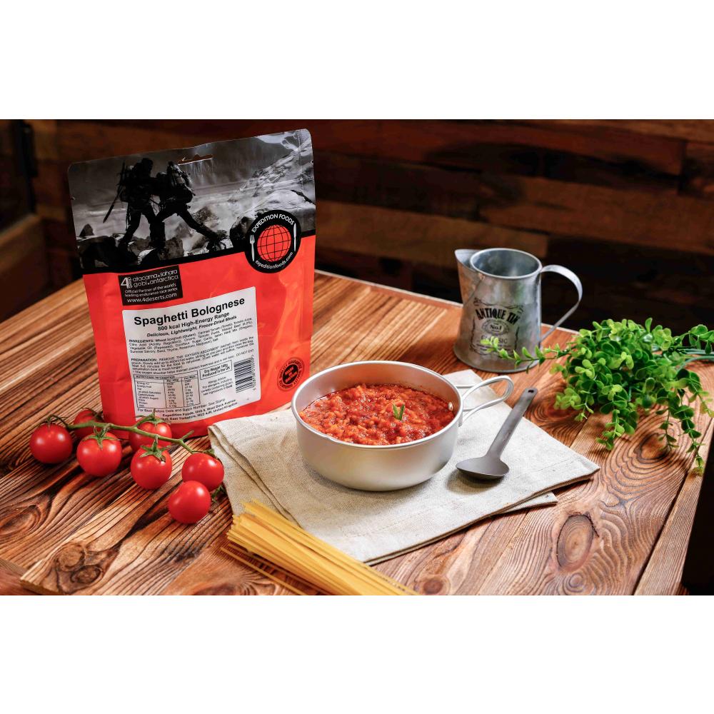 Expedition Foods Spaghetti Bolognese, shown in pack and in bowl on a table