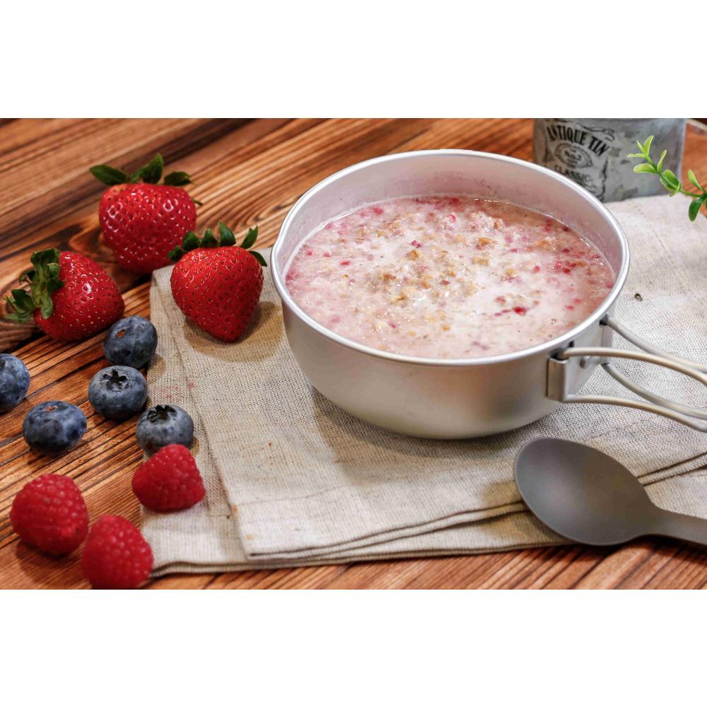 Expedition Foods Granola with Raspberries shown in bowl on a table with fresh ingredients