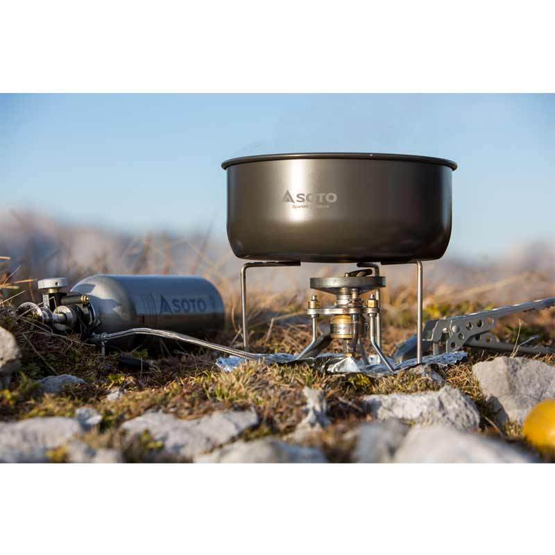 SOTO Storm Breaker Stove shown in use in the outdoors with pan