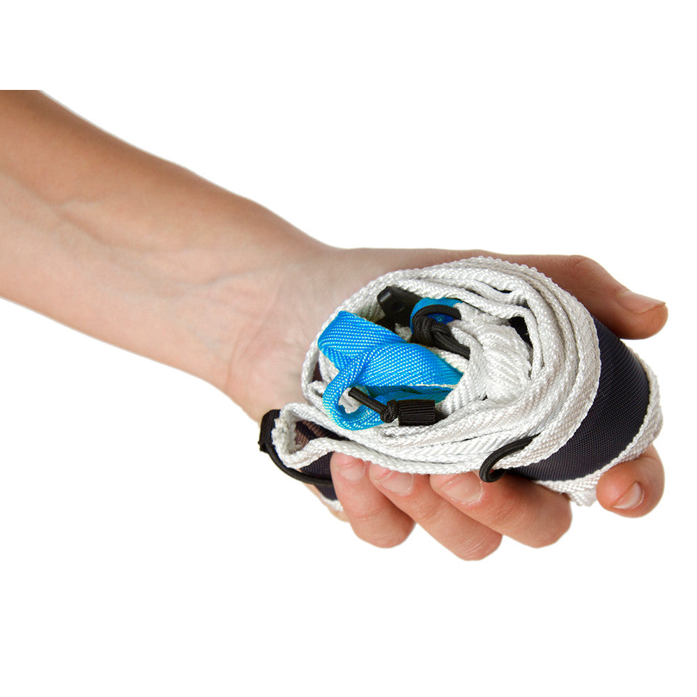 Blue Ice Choucas Light Harness, shown compact in the palm of a models hand