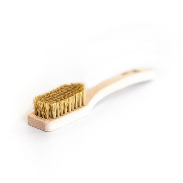 Lapis Uber bouldering Brush with wooden handle, shown laid flat on white surface