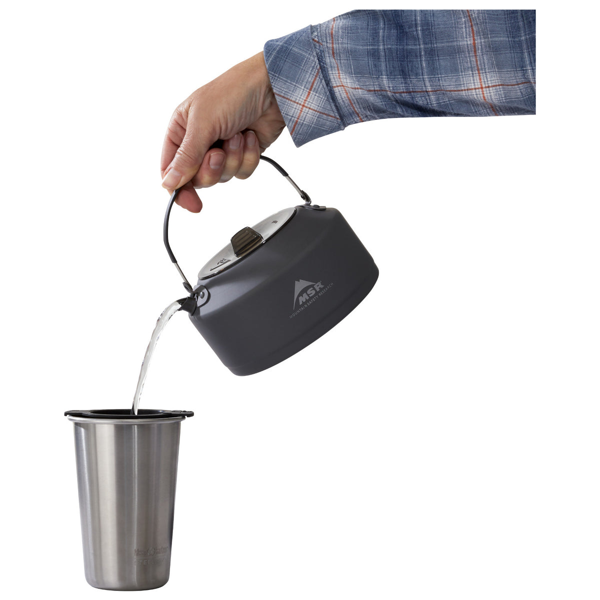 MSR Pika 1.0L Teapot shown in use pouring water into cup